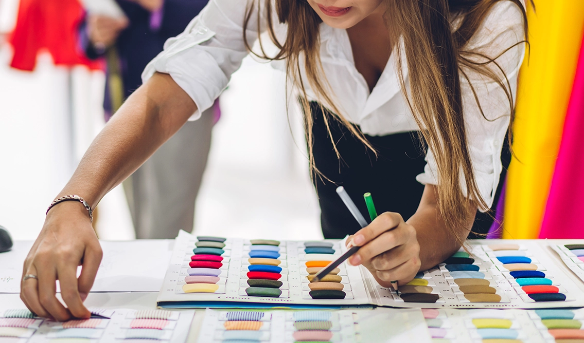 Fashion designer checking fabric swatches