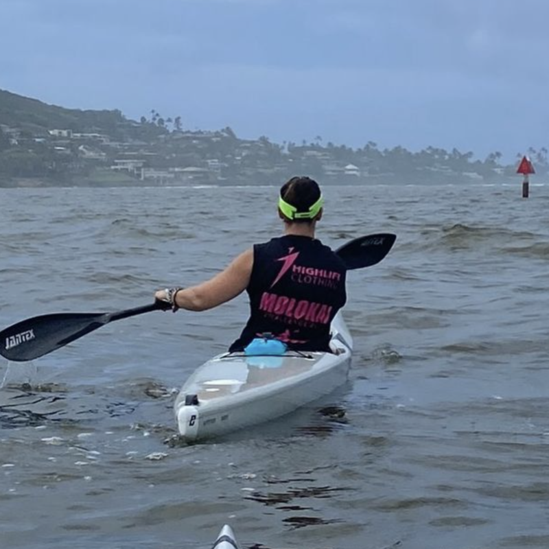 Surfski paddler wearing Highlife branded kit